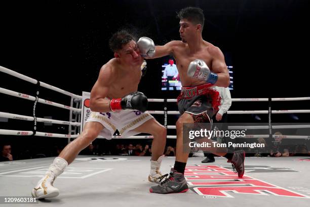 Mikey Garcia punches Jessie Vargas during their WBC Welterweight Diamond Championship bout at The Ford Center at The Star on February 29, 2020 in...