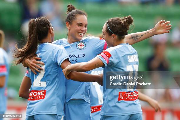 Ally Watt of Melbourne City celebrates with Emma Checker of Melbourne City and Kyah Simon of Melbourne City after scoring a goal during the round 14...