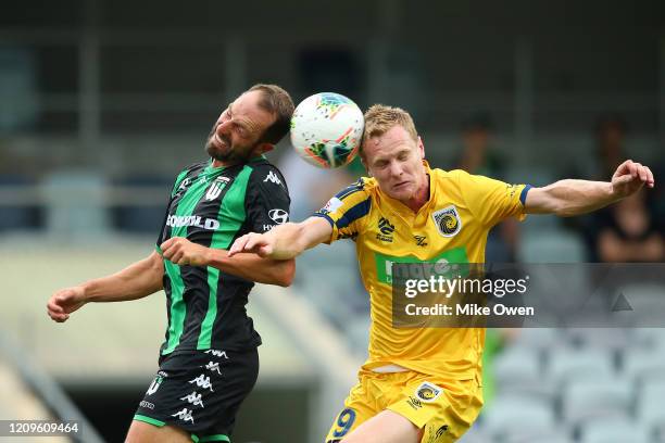 Andrew Durante of Western United and Matt Simon of the Mariners head the ball during the round 21 A-League match between Western United and the...