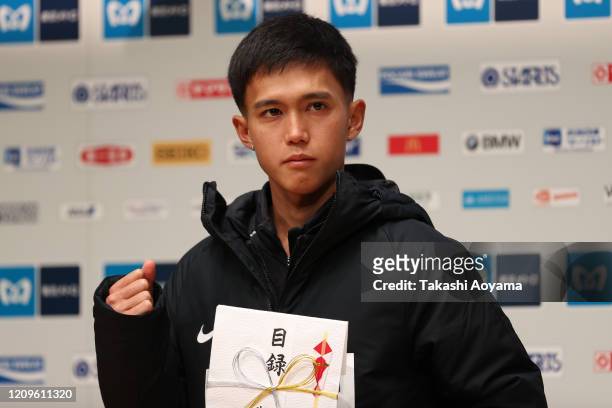 Men’s competition fourth place and new Japanese national record holder Suguru Osako of Japan poses for photograph during the awards ceremony...