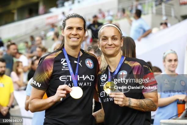 Melbourne City goalkeeper Lydia Williams and Melbourne City goalkeeper Melissa Barbieri pose with their premiers medals after winning the round 14...