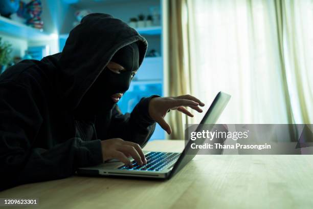 computer hacker stealing information with laptop - phishing email stock pictures, royalty-free photos & images