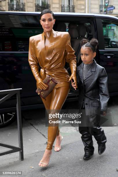 Kim Kardashian and her daughter North West arrive at Theatre des Bouffes du Nord to attend Kanye West's Sunday Service on March 01, 2020 in Paris,...