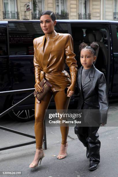 Kim Kardashian and her daughter North West arrive at Theatre des Bouffes du Nord to attend Kanye West's Sunday Service on March 01, 2020 in Paris,...