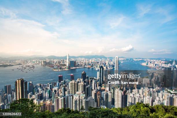 hong kong skyline china - east asia skyscraper cityscape day victoria harbour - hong kong ship sunset futuristic island architecture asia blue city cloud - sky cloudscape development district downtown dusk famous place harbour hong kong island horizontal - two international finance center stock-fotos und bilder