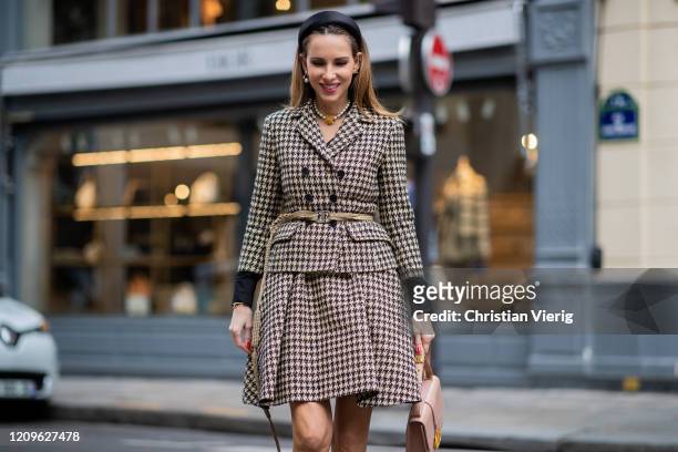 Alexandra Lapp is seen wearing Dior Spring/Summer 2020 Prêt-à-Porter collection, Natural Dior Blazer, Natural Dior skirt and Belt, 30 Montaigne bag...