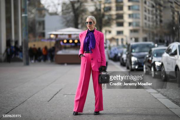 Fashion Week guest is seen wearing a pink suit and Maison Valentino bag outside Haider Ackermann show during Paris Fashion week Womenswear...