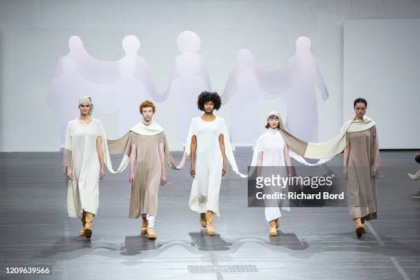Models walk the runway during the Issey Miyake show as part of the Paris Fashion Week Womenswear Fall/Winter 2020/2021 at Lycee Carnot on March 01,...