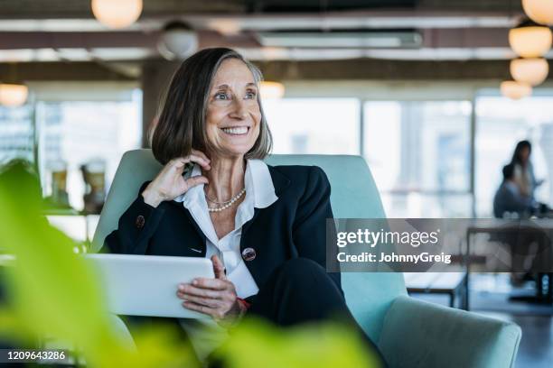 active senior businesswoman with digital tablet in office - personal perspective office stock pictures, royalty-free photos & images