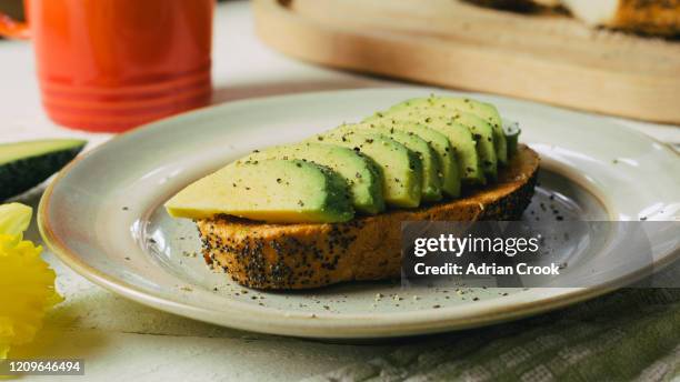 avocado on toast - avocado toast stock pictures, royalty-free photos & images