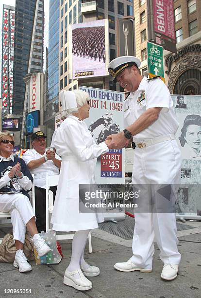 Nurse Edith Shain and Lt. Bob Skibar stage a reenactment of Alfred Eisenstaedt's famous Kiss Photo from August 14, 1945 at Military Island in Times...