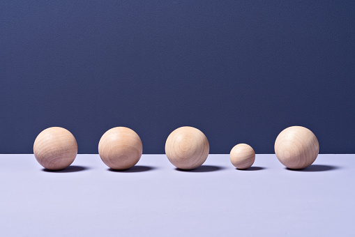 Small Sphere in a Row of Big Spheres