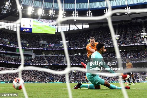 Matt Doherty of Wolverhampton Wanderers scores his sides first goal past Paulo Gazzaniga of Tottenham Hotspur during the Premier League match between...