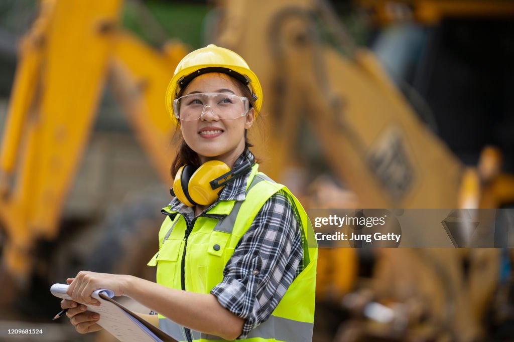 A asian girl construction engineer at construction site