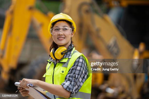 a asian girl construction engineer at construction site - safety equipment stock pictures, royalty-free photos & images