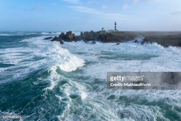storm ciara in bretagne with huge waves on the coast and lighthouses in ushant - ouessant photos et images de collection