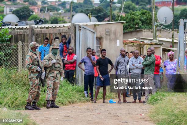 Soldiers during the handing over sanitisers, masks and sanitary packs in the Umlazi township on April 09, 2020 in Durban, South Africa. The...