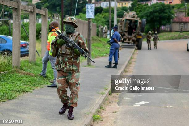 Soldiers during the handing over sanitisers, masks and sanitary packs in the Umlazi township on April 09, 2020 in Durban, South Africa. The...