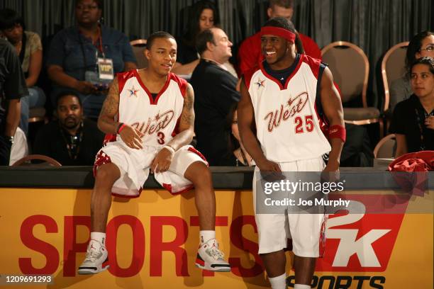 February 16: Hip-hop artist Bow Wow and NFL player Reggie Bush of Team West shares a laugh during the McDonald's NBA All-Star Celebrity Game...