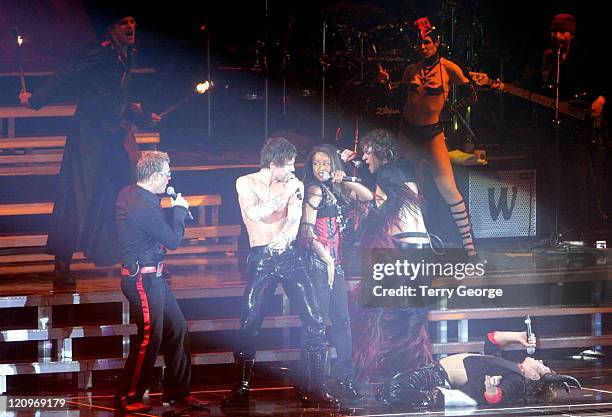 Gary Barlow, Jason Orange and Howard Donald of Take That perform with Beverley Knight