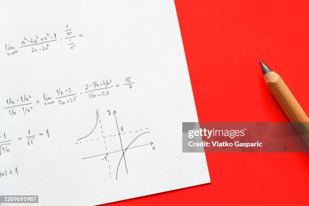 handwritten mathematical formulas and algebra with pencil - mathematician stockfoto's en -beelden