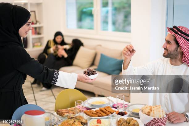 preparing with dates near end of fasting day - saudi lunch stock pictures, royalty-free photos & images