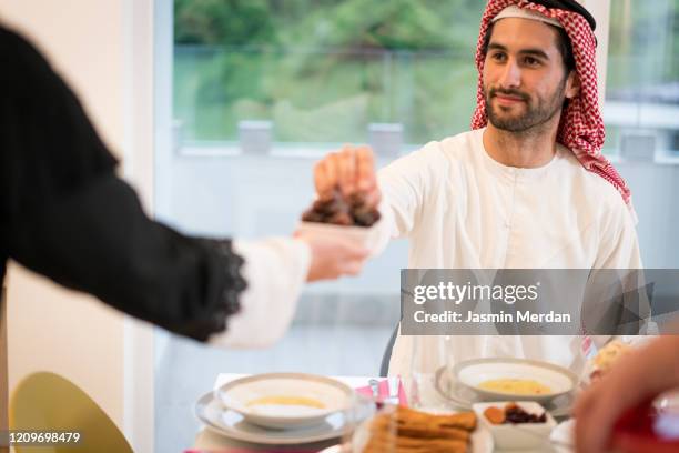 preparing with dates near end of fasting day - saudi lunch stock pictures, royalty-free photos & images