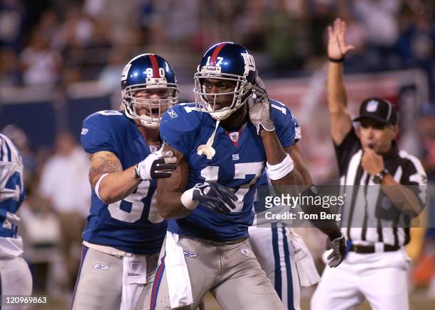 New York Giants tight end Jeremy Shockey celebrating with his team mate wide receiver Plaxico Burress after a big play he had 4 catches for 80 yards...