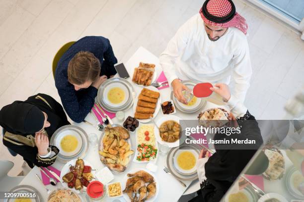 top view of food table of friends - saudi lunch stock pictures, royalty-free photos & images