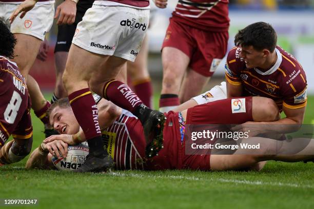 George Burgess scores a try during the Betfred Super League match between Huddersfield Giants and Wigan Warriors at John Smith's Stadium on March 01,...