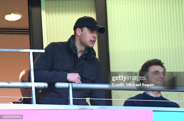 Aston Villa fan Prince William Duke of Cambridge with Thomas van Straubenzee watches on from the stands during the Carabao Cup Final between Aston...