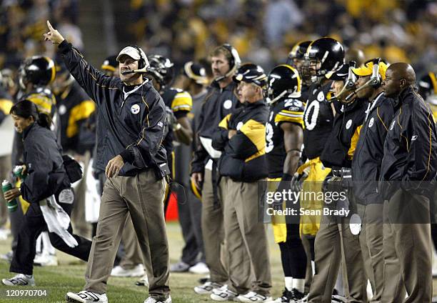 Pittsburgh Steelers Head Coach Bill Cowher disputes time remaning on the game clock late in the 4th quarter of play during action against the...