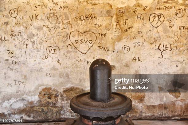 Graffiti scratched into the wall behind a Shiva Lingam at the Brihadeeswarar Temple is a Hindu temple dedicated to Lord Shiva located in Thanjavur,...