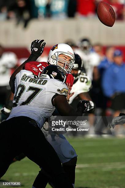 Arizona Cardinals quarterback Kurt Warner is hit while trying to unleash a pass during a game against the Jacksonville Jaquars at Sun Devil Stadium...