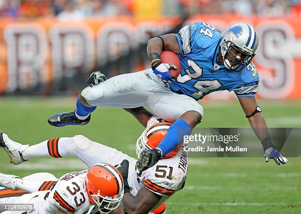 Detroit Lions Running Back, Kevin Jones, is upended by Cleveland's Chaun Thompson during their game, Sunday October 23, 2005 at Cleveland Browns...