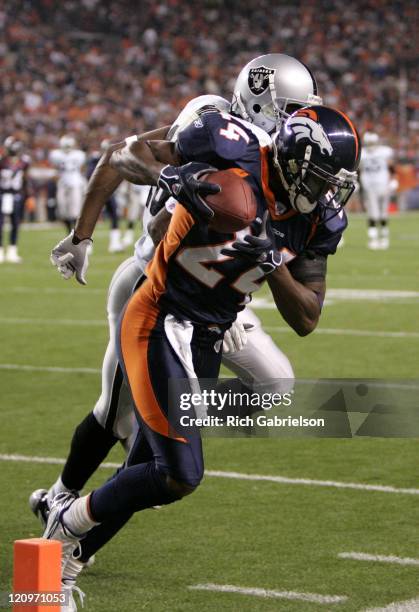 Cornerback Champ Bailey intercepts a pass intended for Oakland Raiders wide receiver Randy Moss. The Denver Broncos defeated the Oakland Raiders by a...