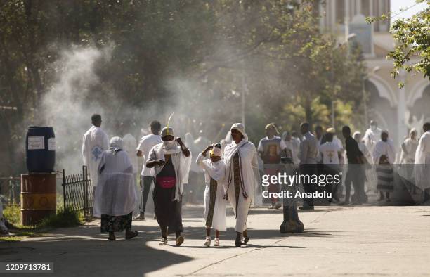 Ethiopian Orthodox Christians, with some wearing leaf crowns made out of date palms, make their way to attend the Hosanna Day celebrations held a...