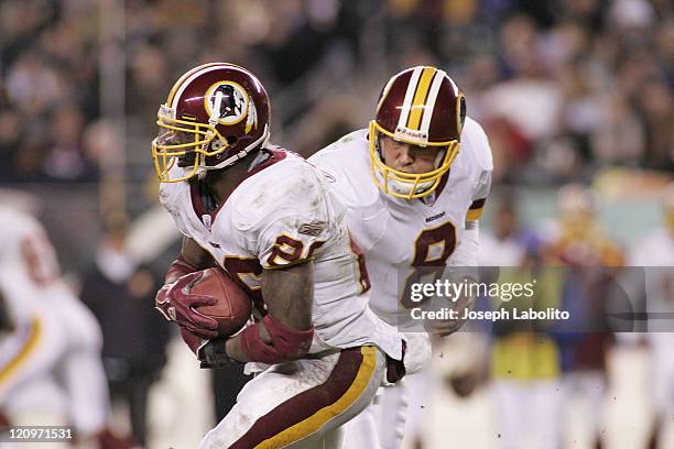 Redskins Quarterback Mark Brunell hands off to running back Clinton Portis . The Washington Redskins defeated the Philadelphia Eagles 31 to 20 at...