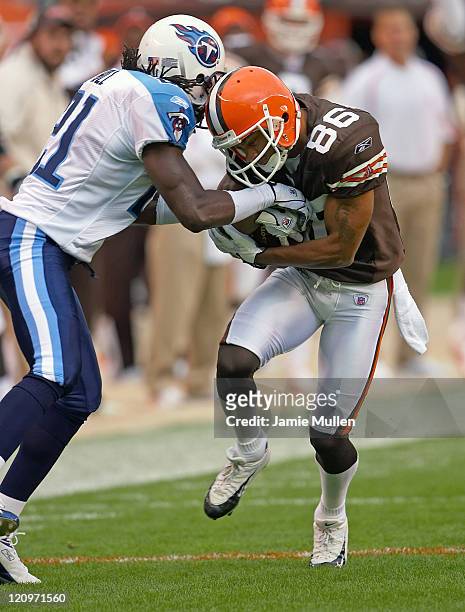 Cleveland Browns Wide Receiver, Dennis Northcutt, on his way to a 58 yard touchdown reception as Tennessee's Reynaldo Hill tries to strip the ball...