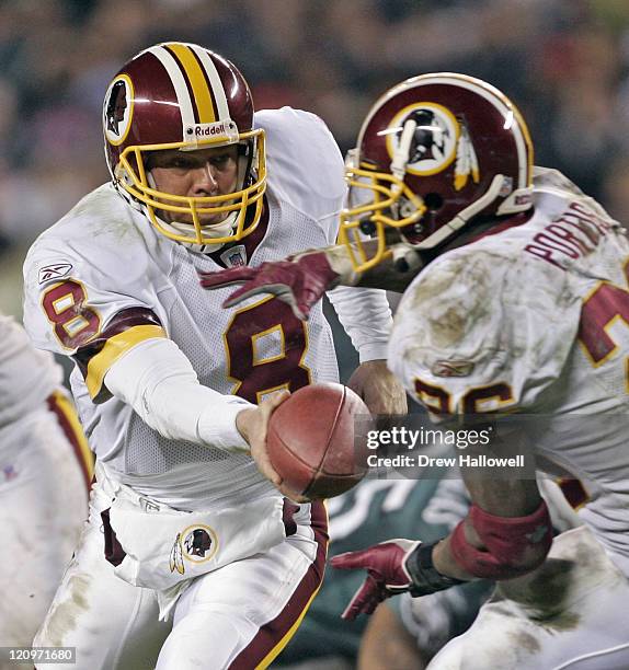 Washington Redskins quarterback Mark Brunell hands the ball off to running back Clinton Portis Sunday, January 1, 2006 at Lincoln Financial Filed in...