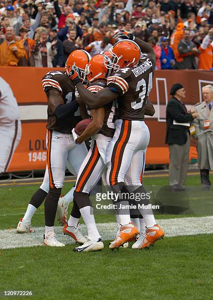 Cleveland Browns Wide Receiver, Dennis Northcutt, is congratulated in the end zone by teammates after scoring on a 58 yard touchdown during the game...