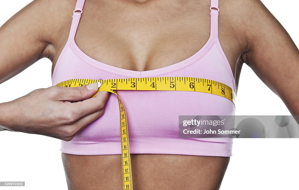 Woman measuring herself