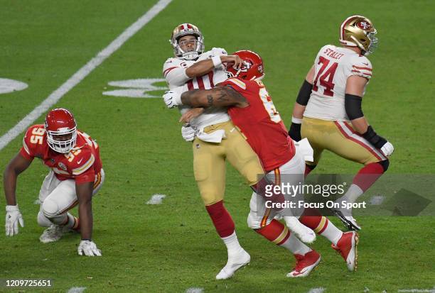 Mike Pennel of the Kansas City Chiefs puts the pressure on quarterback Jimmy Garoppolo of the San Francisco 49ers in Super Bowl LIV at Hard Rock...