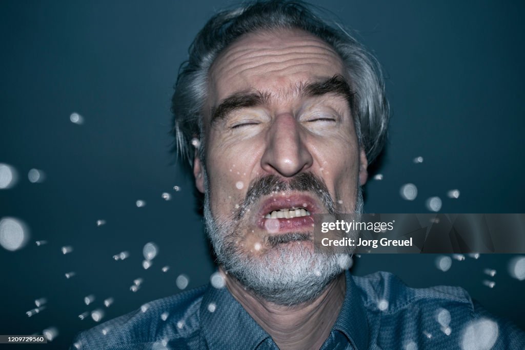 Sneezing man