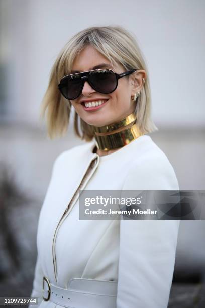 Xenia Adonts is seen wearing Bottega Veneta heels and a beige coat outside the Elie Saab show during Paris Fashion week Womenswear Fall/Winter...