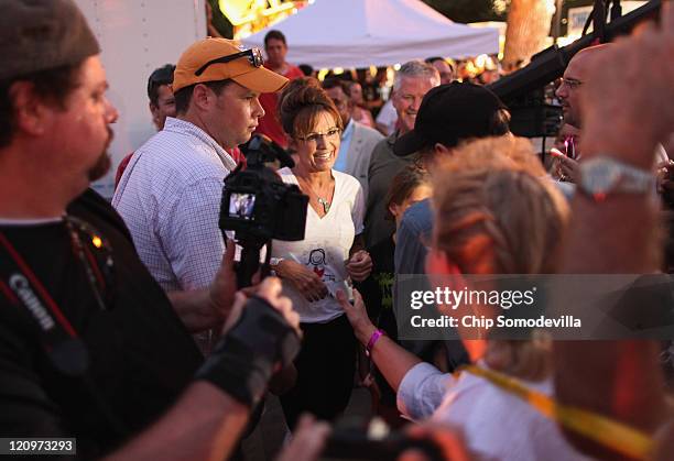 Former Alaska Governor Sarah Palin greets supporters after appearing on the Sean Hannity Show during the Iowa State Fair August 12, 2011 in Des...