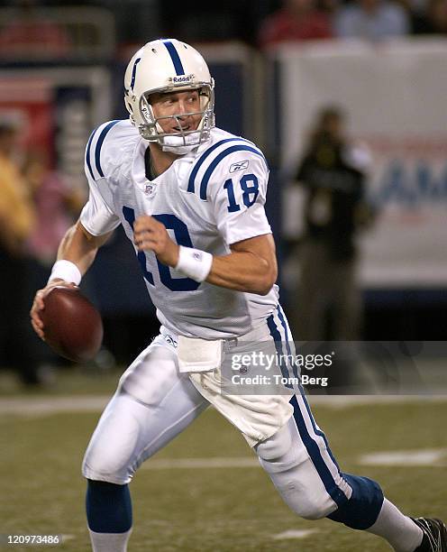 Indianapolis Colts quarterback Peyton Manning scrambling out of the pocket looking for a open receiver down field during the Indianapolis Colts vs...