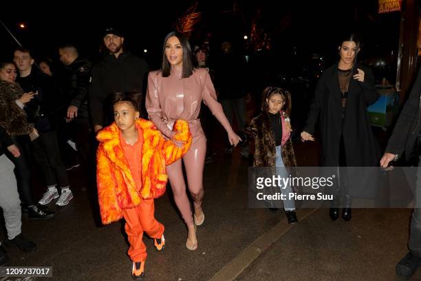 Kim Kardashian, North West ,Penelope Disick and Kourtney Kardashian are seen near the Eiffel Tower on March 01, 2020 in Paris, France.