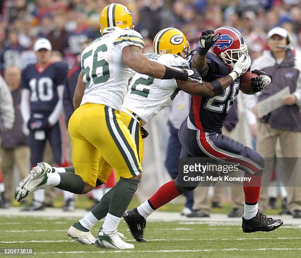 Packers defender Marquand Manuel grabs the face mask of Bills running back Anthony Thomas during game between the Green Bay Packers and the Buffalo...