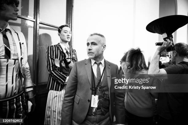 Thom Browne prepares a model backstage before the Thom Browne Womenswear Fall/Winter 2020/2021 show as part of Paris Fashion Week on March 01, 2020...